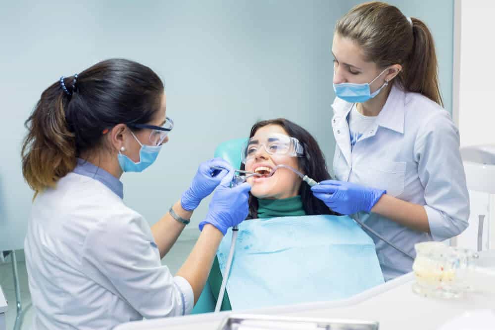 Dentist providing gum disease treatment and professional cleaning in Belmont WA