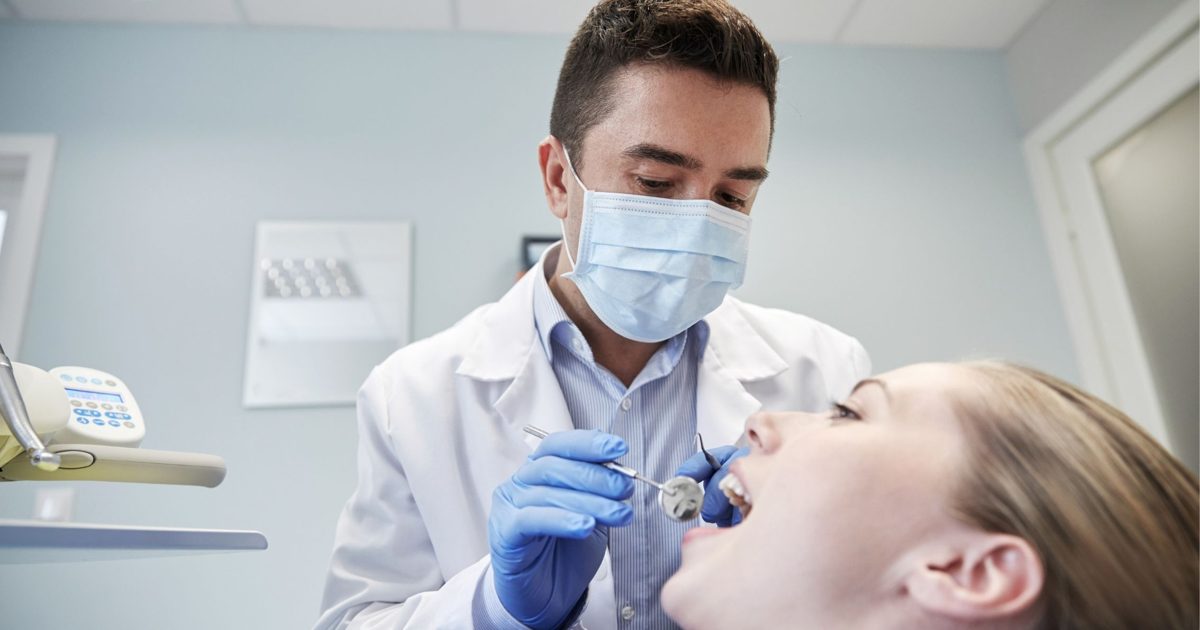 Dentist examining a patient’s teeth in Belmont WA